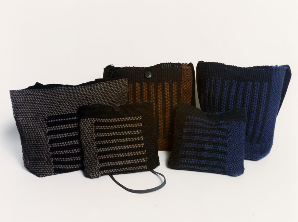 Winter handbags in waxed cotton and rug wool